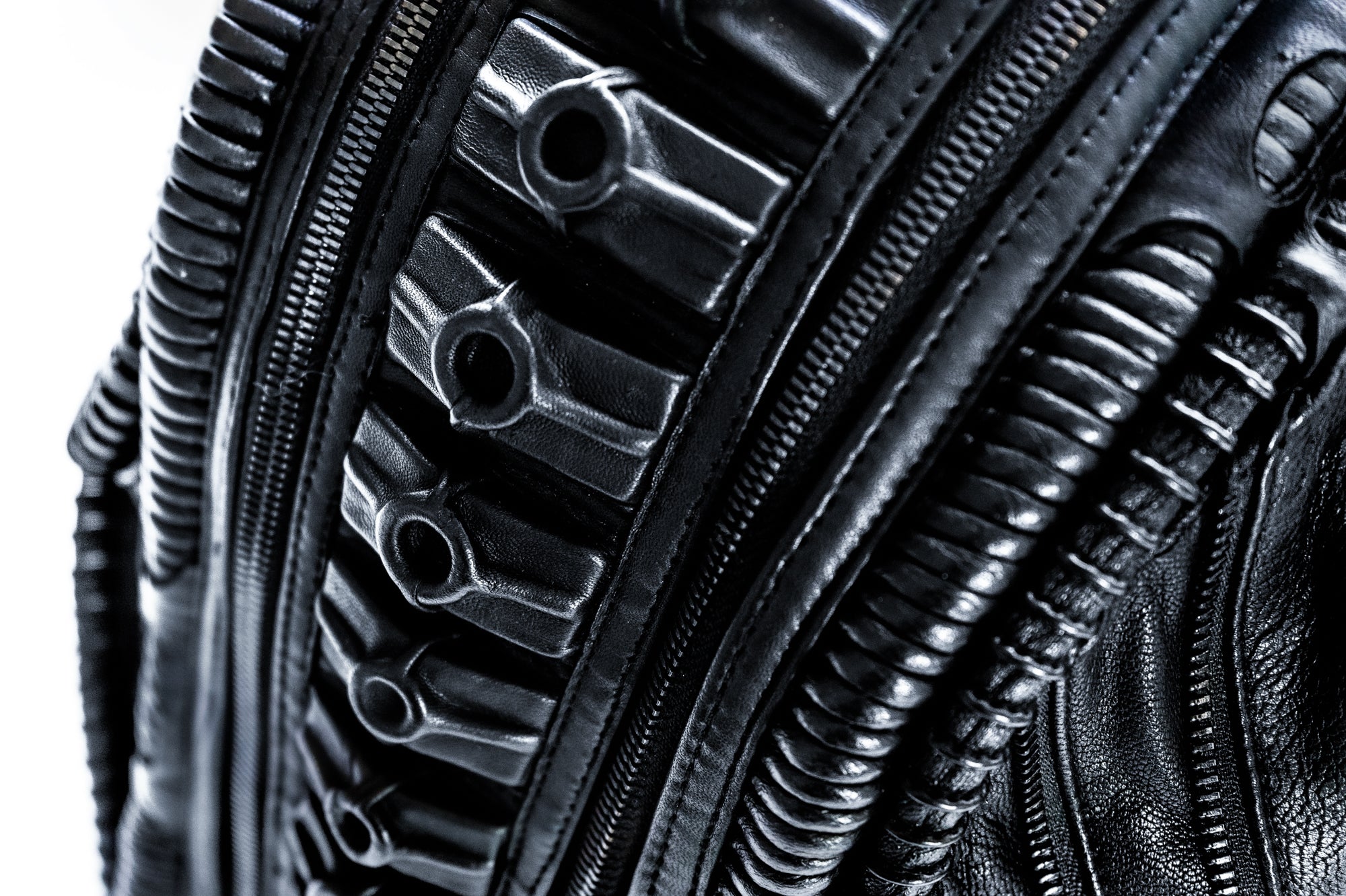 Avant-garde biomorphic backpack in dark post-apocalyptic fashion and leather handcrafted detail