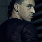 Rear three-quarter view of the black SYZMIC MESH T-SHIRT 213 showing its semi-sheer mesh texture.
