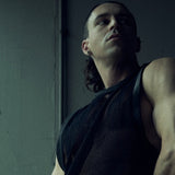 Low-angle front view of the black SYZMIC MESH TANK TOP 211 in textured organic cotton mesh.