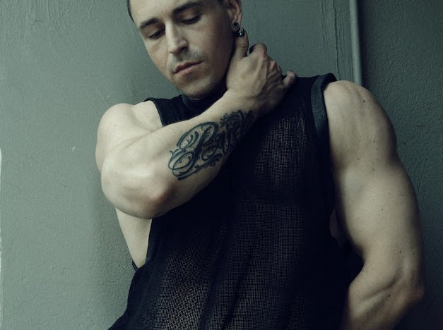 SYZMIC MESH TANK TOP 211 in black, front view showing the sleeveless cut and narrow rib neckline.