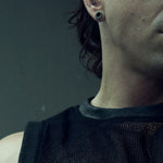 Close-up of the round neckline and black wax-coated rib trim on the SYZMIC MESH TANK TOP 211.