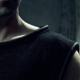 Close-up of the black MESH TANK TOP 212 showing textured cotton mesh and tubular neck trim.