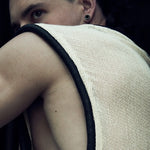 Rear view of the white/ecru SYZMIC MESH TANK TOP 212 with black tubular trim.