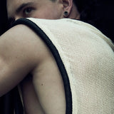 Rear view of the white/ecru SYZMIC MESH TANK TOP 212 with black tubular trim.