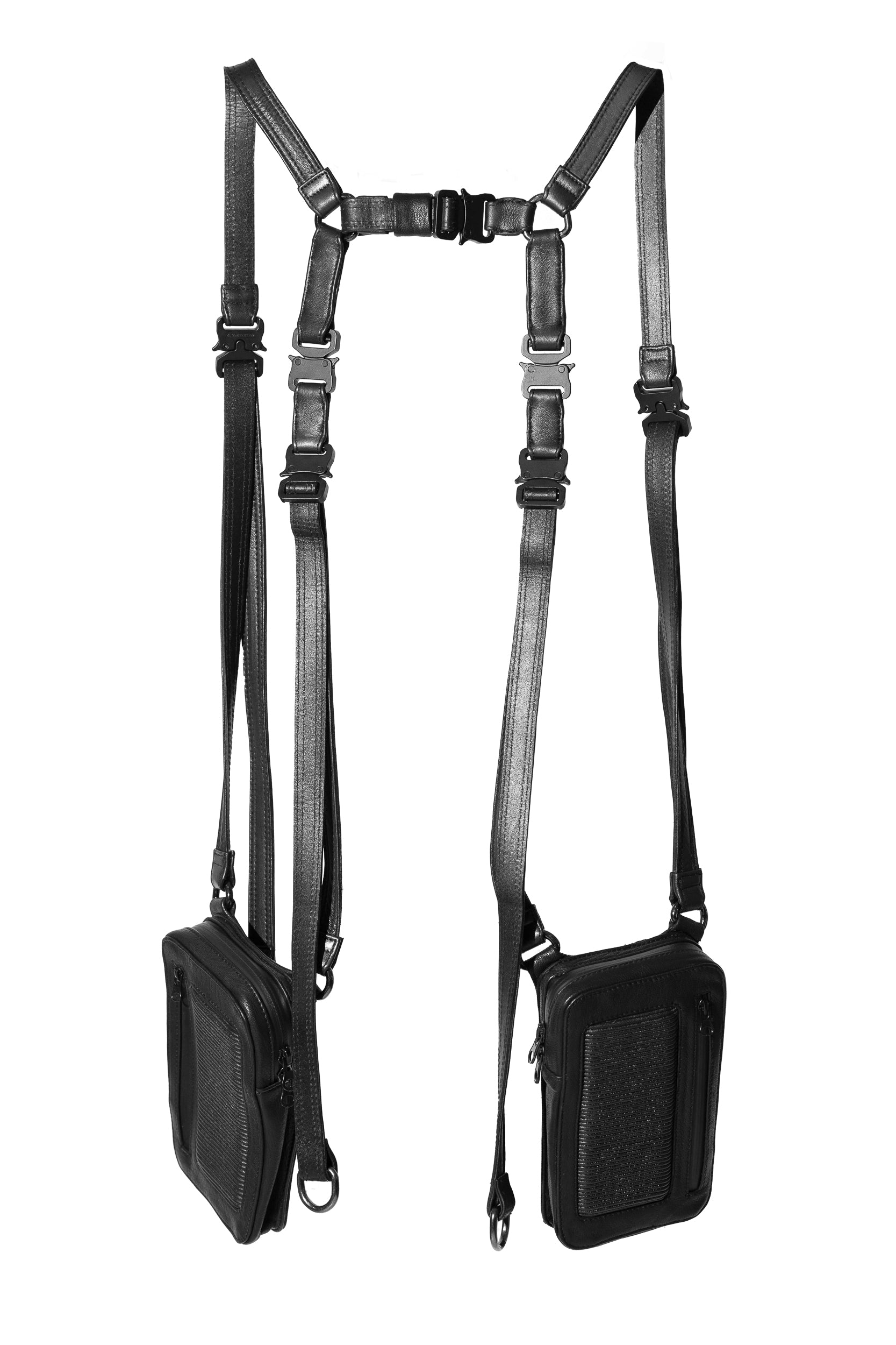 A black leather harness bag with dual pouches and adjustable straps, designed in a holster style.