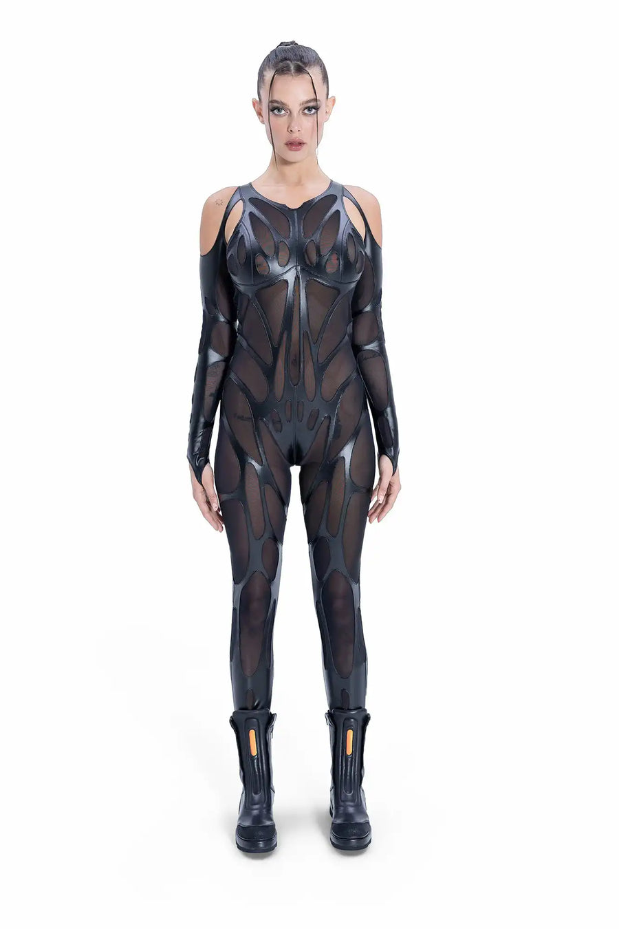 Futuristic EIDOS-202 catsuit by Syzmic Studio in black mesh and vegan leather with biomorphic cutouts.