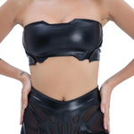 Front view of Syzmic Studio EIDOS-203 crop top in black vegan leather with biomorphic cutouts, avant-garde futuristic fashion.