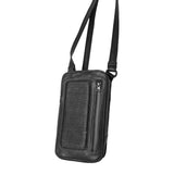 Angled front view showcasing the black leather shoulder bag with adjustable strap and ribbed design, emphasizing its sleek, compact form.