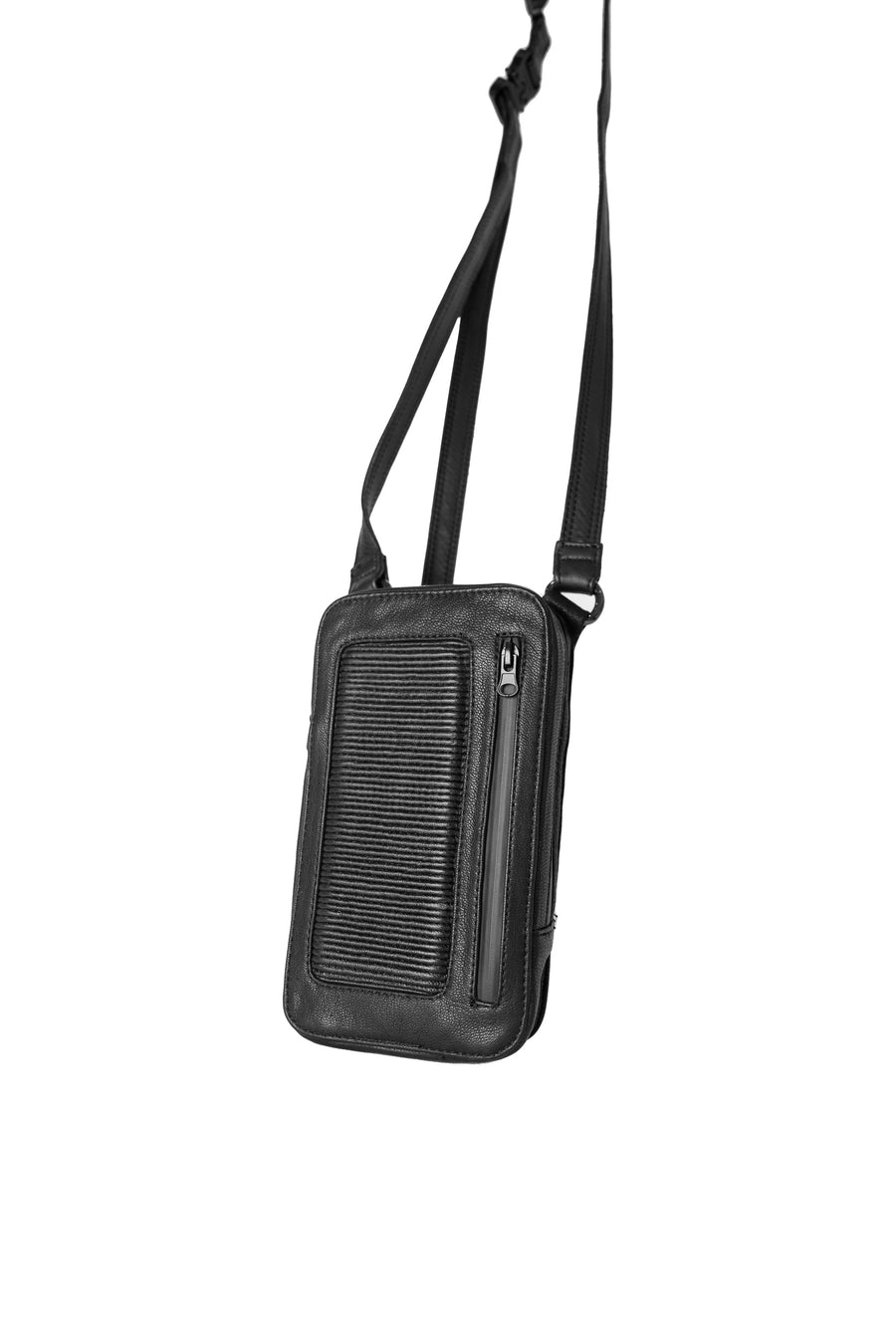 Angled front view showcasing the black leather shoulder bag with adjustable strap and ribbed design, emphasizing its sleek, compact form.