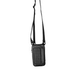 Full length view of a black leather shoulder bag hanging by its strap, demonstrating the bag’s versatility and stylish appearance.