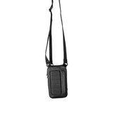Full length view of a black leather shoulder bag hanging by its strap, demonstrating the bag’s versatility and stylish appearance.