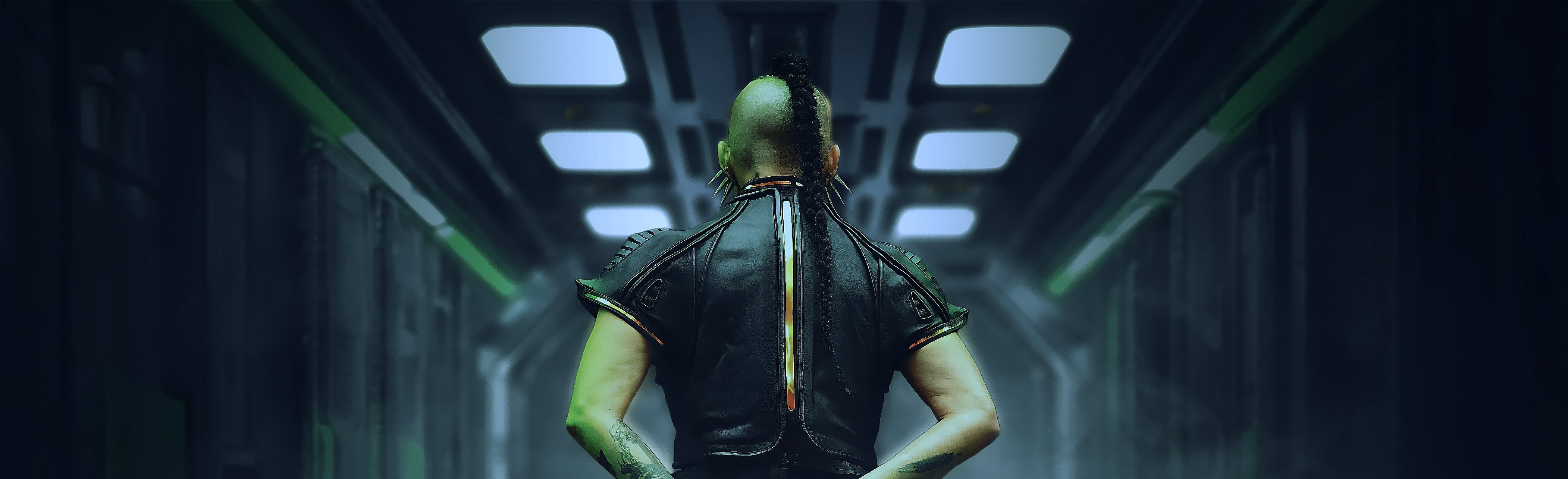 Person in futuristic armor sitting in a dark, sci-fi corridor.