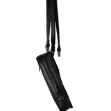 Side view of a black leather shoulder bag with a thin, adjustable strap, highlighting its slim profile and functional design.