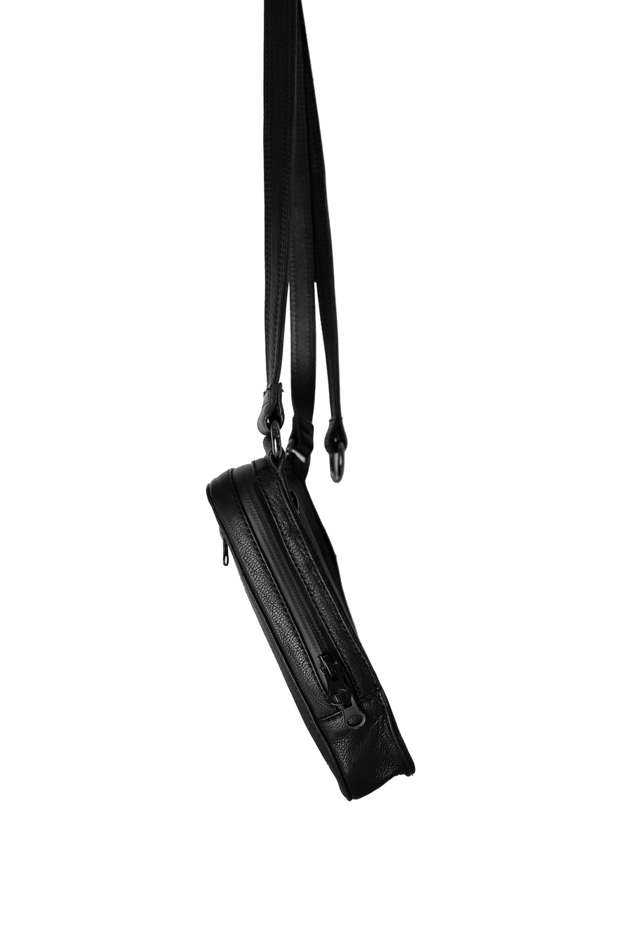 Side view of a black leather shoulder bag with a thin, adjustable strap, highlighting its slim profile and functional design.