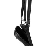 Close-up of the open main compartment of a black leather shoulder bag, illustrating the satin lining and internal pocket configuration.