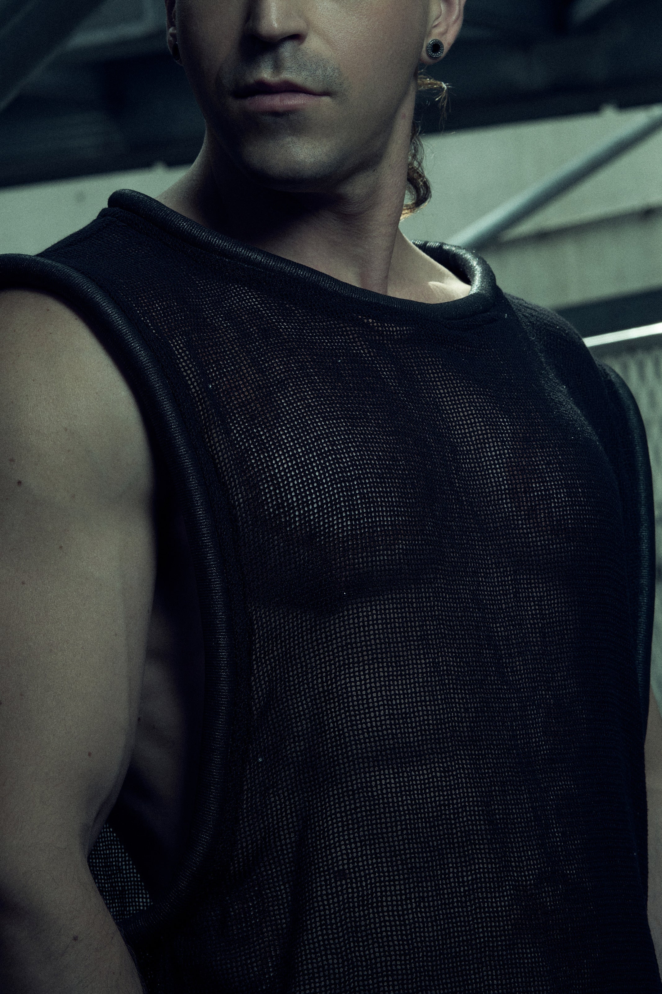 Black SYZMIC EIDOS-212 organic cotton mesh tank top, portrait with tubular piping at the neck and armholes.