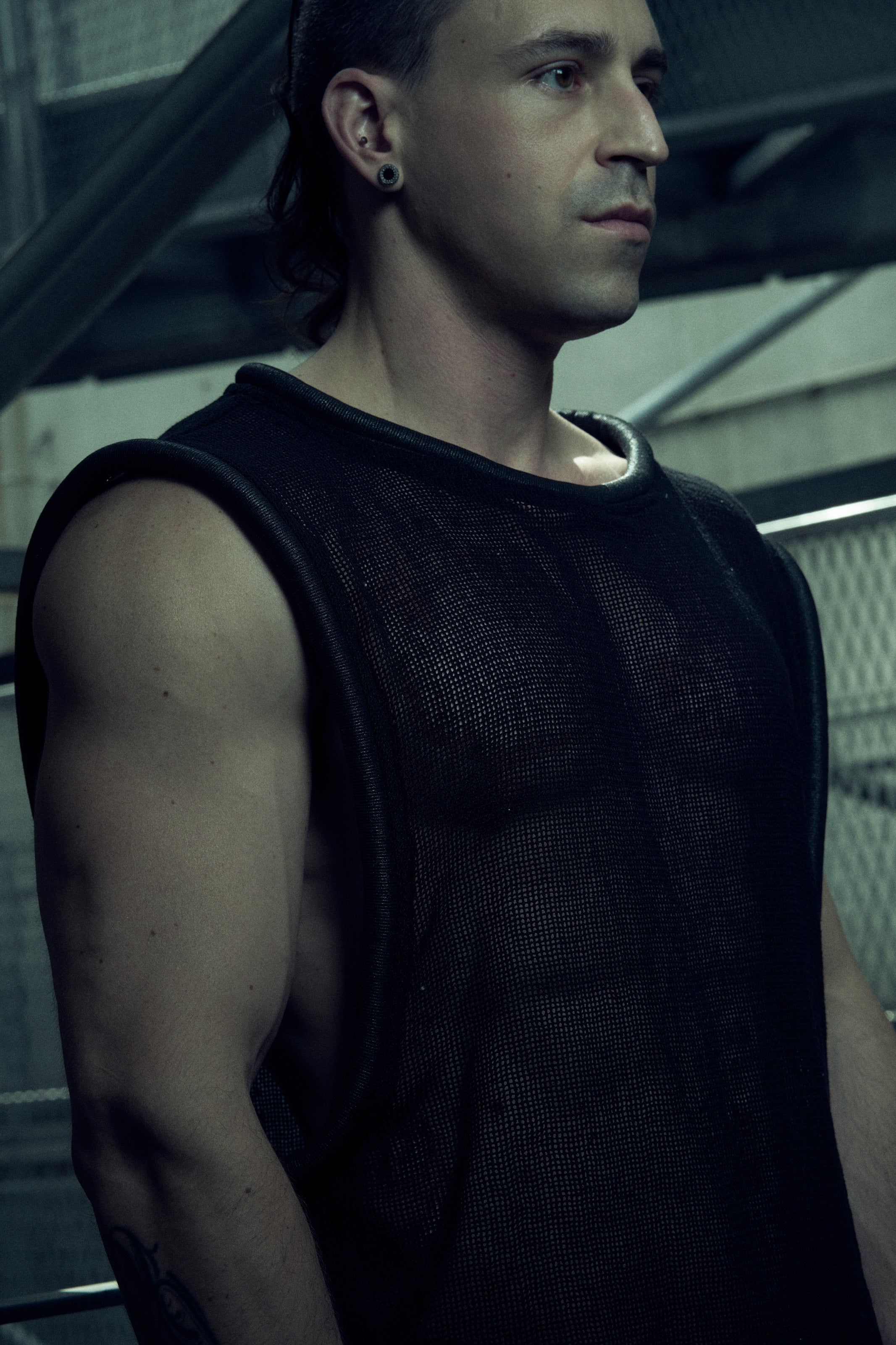 Black SYZMIC EIDOS-212 tank top worn in a three-quarter pose.