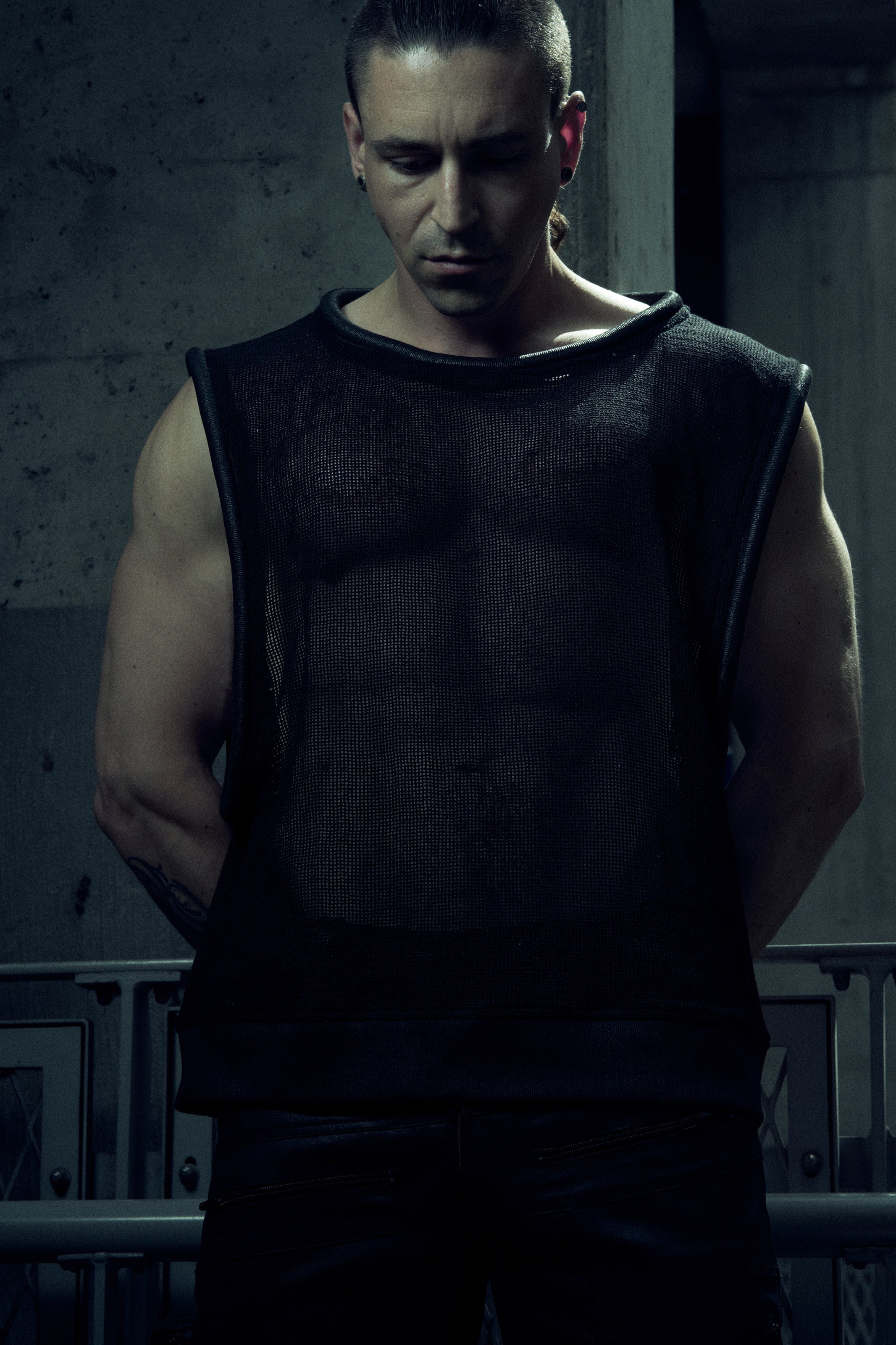 Front view of the black SYZMIC EIDOS-212 mesh tank top with rounded piping.