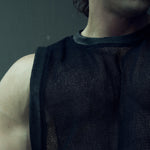 Close-up of the black EIDOS-214 tank top showing the round rib neckline and organic cotton mesh.
