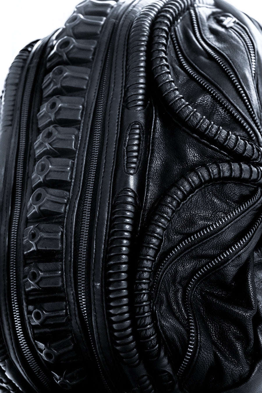 Avant-garde biomorphic backpack in dark post-apocalyptic fashion and leather handcrafted detail