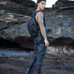 Men's alternative apparel in post-apocalyptic fashion with leather alien backpack