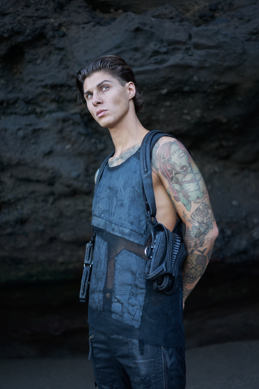 Dark post-apocalyptic apparel with leather holster bag and alternative mesh tank top