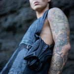 Avant-garde double pocket harness bag with exoskeleton claw magnet clasp
