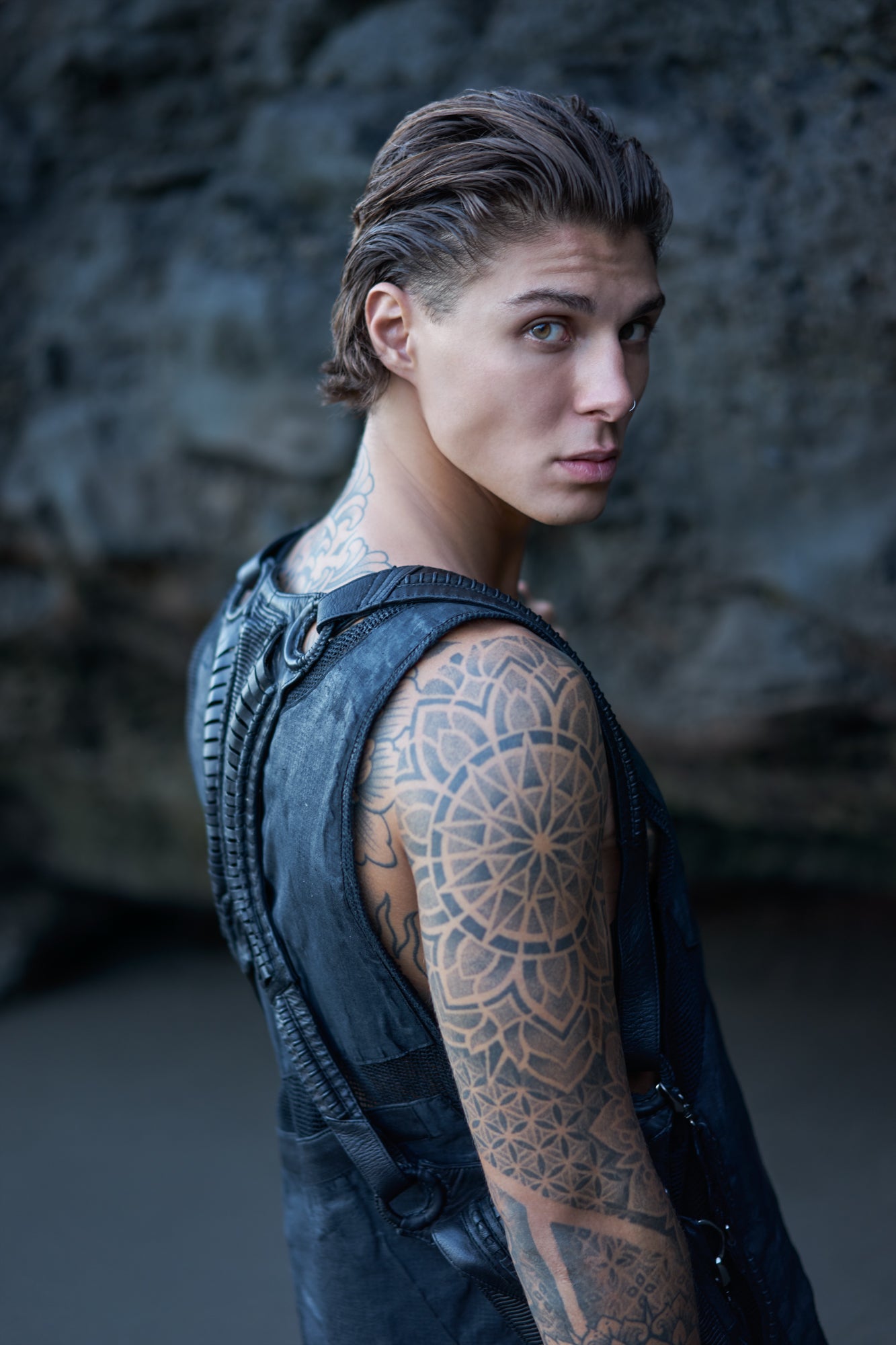 Dark post-apocalyptic harness bag on a men's waxed sleeveless shirt
