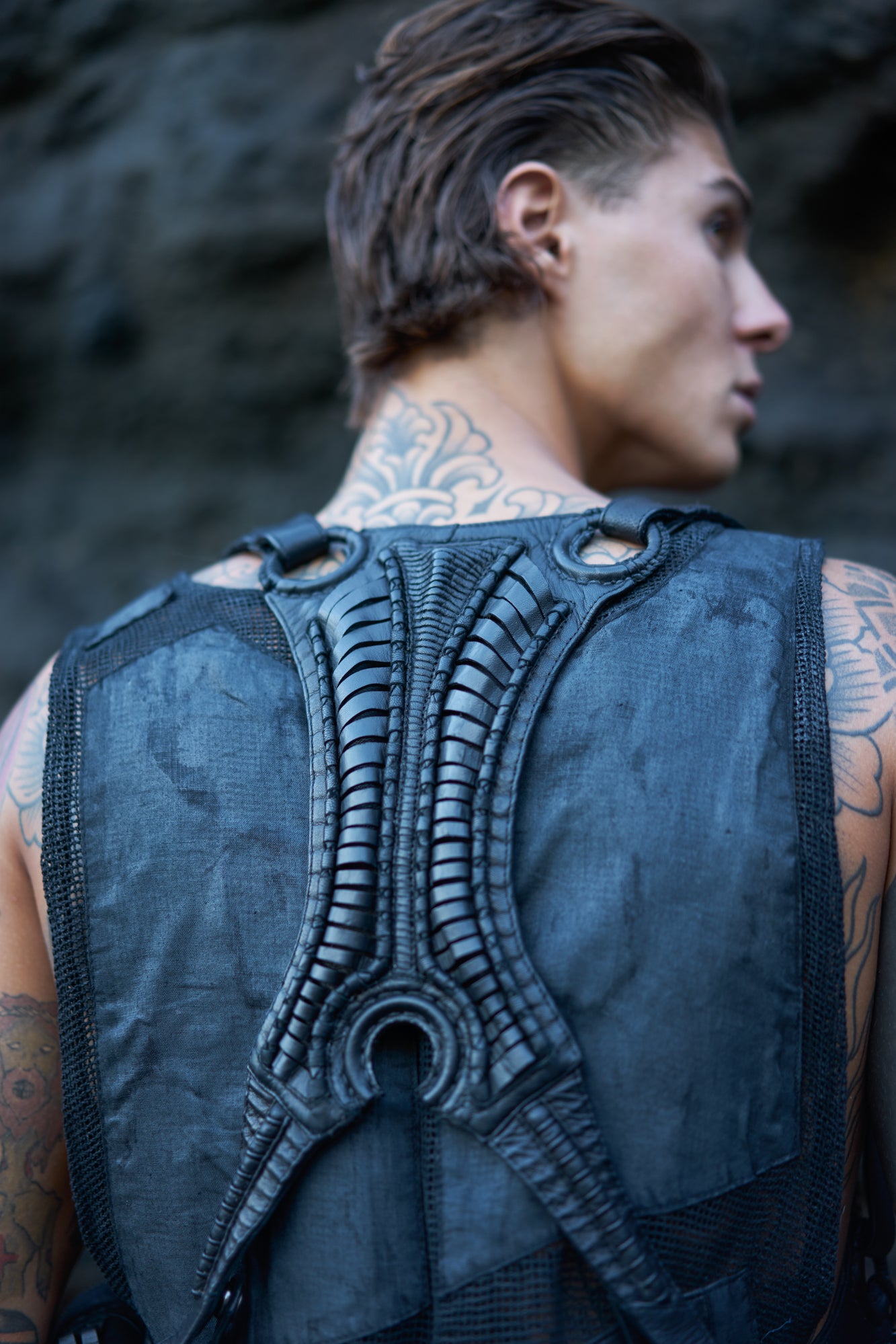 Unisex, avant-garde double pouch leather harness bag with biomorphic vertebral back panel & vein straps