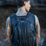 Unisex leather accessories in post-apocalyptic cyberpunk style with men's futuristic textured mesh tank top