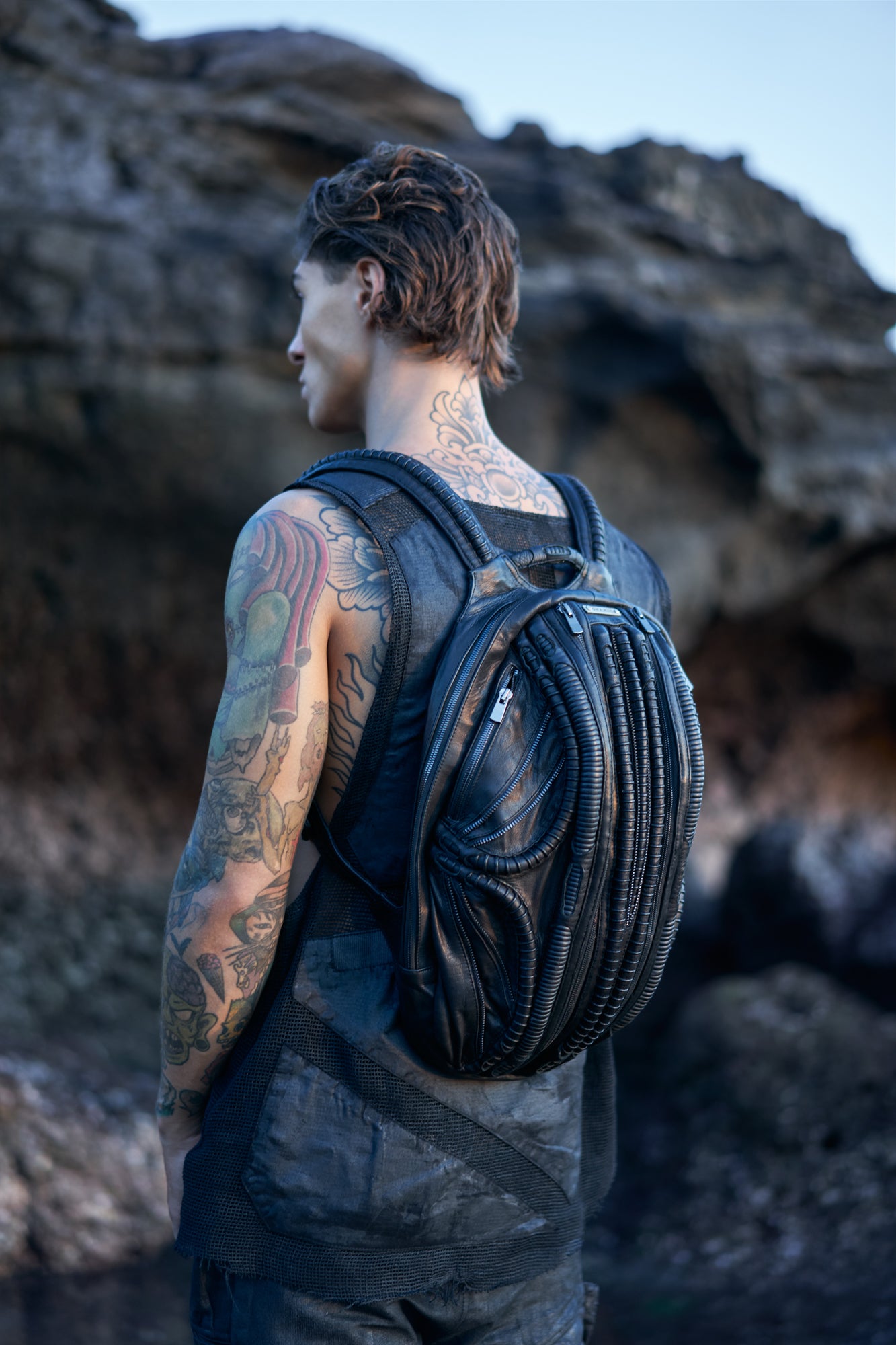 Men's avant-garde fashion accessories with leather laptop backpack in biomorphic xenomorph Giger design