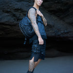 Avant-garde streetwear with unisex leather accessories in dark post-apocalyptic fashion