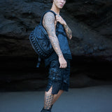 Avant-garde streetwear with unisex leather accessories in dark post-apocalyptic fashion