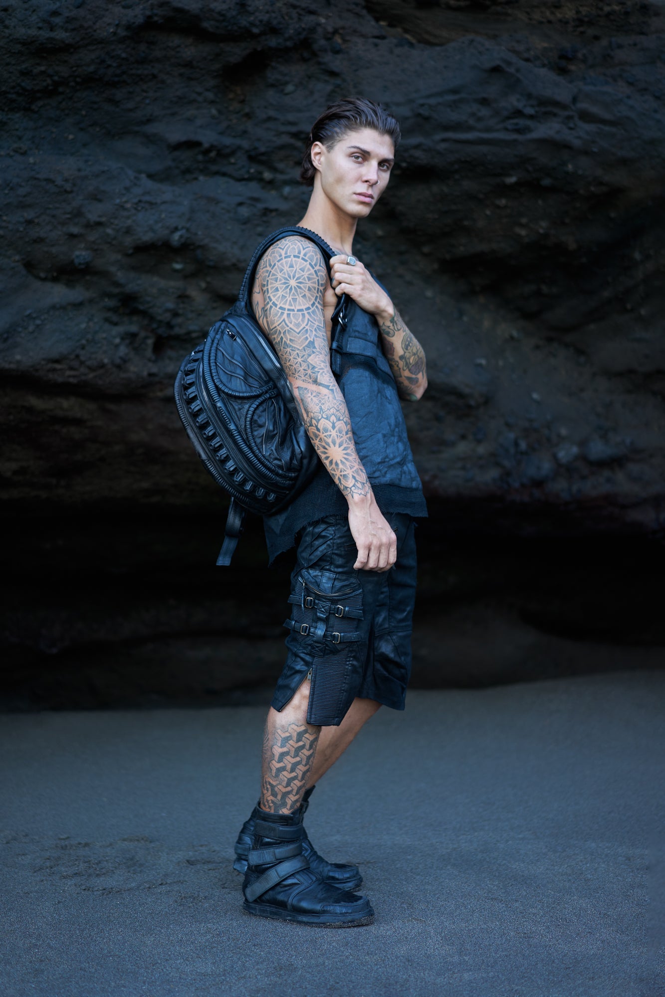 Avant-garde streetwear with unisex leather accessories in dark post-apocalyptic fashion