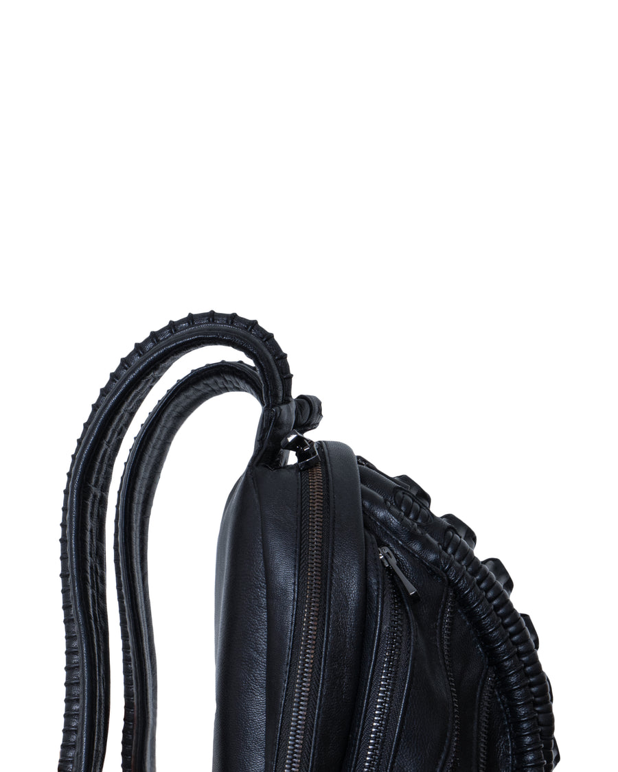 Avant-garde biomorphic backpack in dark post-apocalyptic fashion and leather handcrafted detail