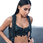 Women's avant-garde streetwear with dark post-apocalyptic bustier top, booty shorts and alien xenomorph leather backpack