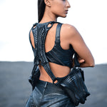 Alien xenomorph inspired back panel with biomorphic exoskeleton construction on leather harness bag & hot pants