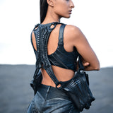 Alien xenomorph inspired back panel with biomorphic exoskeleton construction on leather harness bag & hot pants